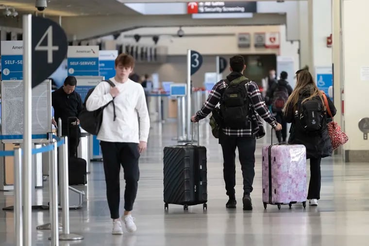 Travelers arrived at the Philadelphia International Airport on Wednesday, Nov. 23, 2022, in Philadelphia, Pa.