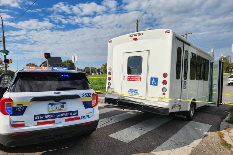 A private bus transporting 12 people on Roosevelt Boulevard and West Courtland Street is roped off by police after gunfire struck its driver's side window and injured the bus driver.