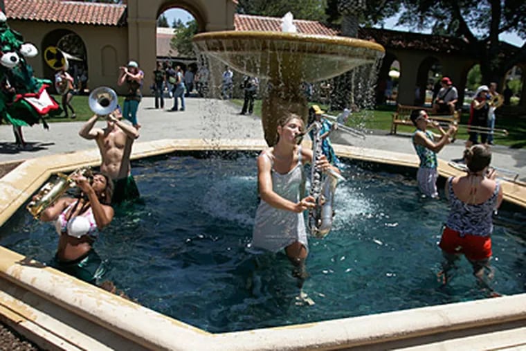 Eva Glasrud, center, a student at Stanford University, and other members of Stanford's band perform during a fountain rally on May 22. (Patrick Tehan / San Jose Mercury News/MCT)