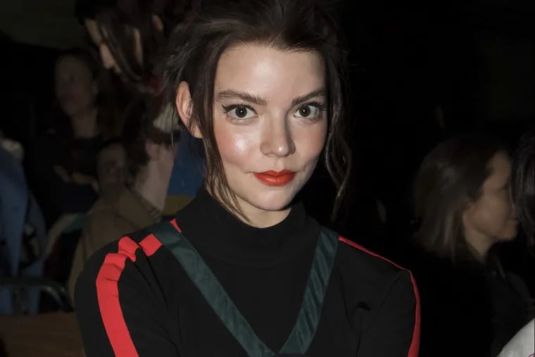 Actress Anya Taylor-Joy poses for photographers before the Burberry Autumn/Winter 2018 fashion week runway show in London, Saturday, Feb. 17, 2018.