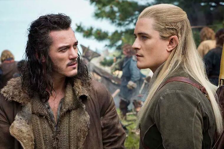 Photo Credit: Mark Pokorny

Caption: (L-r) LUKE EVANS as Bard and ORLANDO BLOOM as Legolas in the fantasy adventure "THE HOBBIT: THE BATTLE OF THE FIVE ARMIES," a production of New Line Cinema and Metro-Goldwyn-Mayer Pictures (MGM), released by Warner Bros. Pictures and MGM.