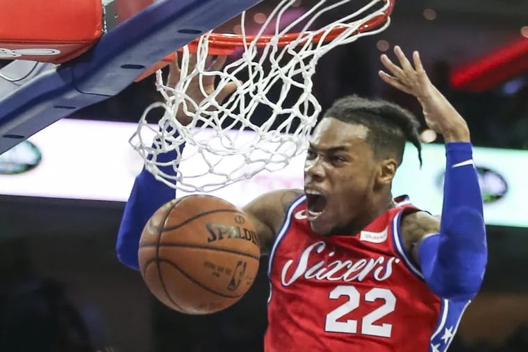 Sixers’ Richaun Holmes slam dunks against the Heat during the 2nd quarter at the Wells Fargo Center in Philadelphia, Wednesday, February 14, 2018.