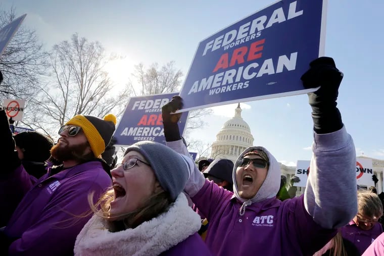 On the 20th day of a partial government shutdown, federal employees rally at the Capitol to protest the impasse between Congress and President Donald Trump over his demand to fund a U.S.-Mexico border wall, in Washington, Thursday,  Jan. 10, 2019. (AP Photo/J. Scott Applewhite)