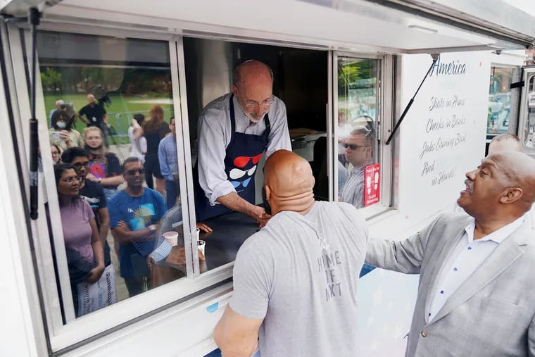 During a Fourth of July weekend celebration last year, Thomas Stintsman (front left) thanks Gov. Tom Wolf for signing the "Clean Slate" law, which allows for certain criminal records to be sealed.