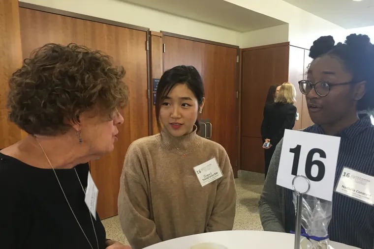 Freshmen nursing majors Susan Younghyeon Kim (center) and Nadjulia Constant (right) get advice from Mary Agnes Ostick, assistant director of Villanova's health center, at a professional networking program at Villanova University.