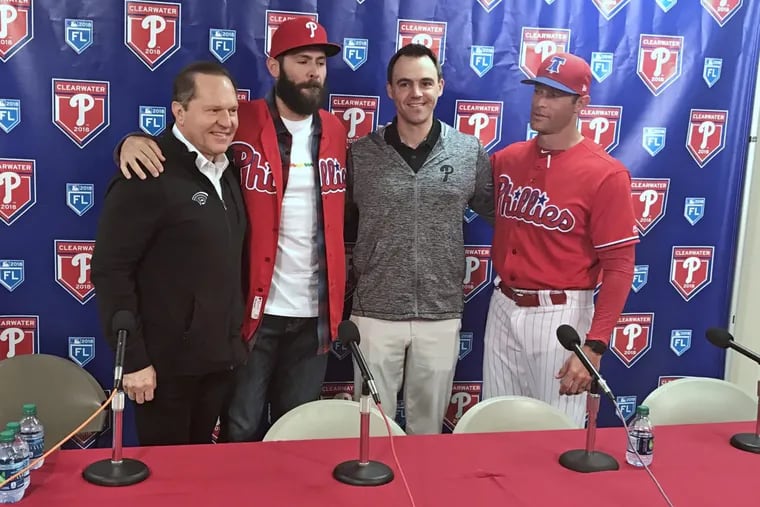 New Phillies pitcher Jake Arrieta (second from left) at his introductory press conference Tuesday with (from left) agent Scott Boras, Phillies general manager Matt Klentak and Phillies manager Gabe Kapler.