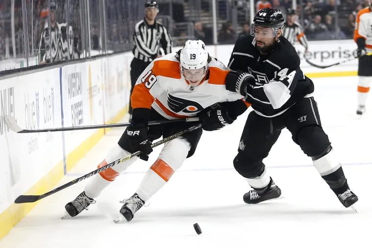 Flyers forward Nolan Patrick and Kings forward Nate Thompson vie for the puck during the first period.