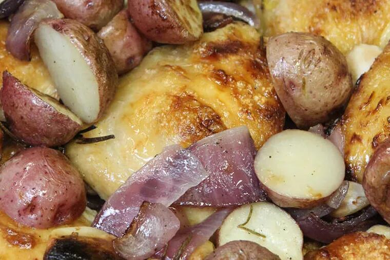 chicken with potaoes and onions.   ( CHARLES FOX / Staff Photographer )