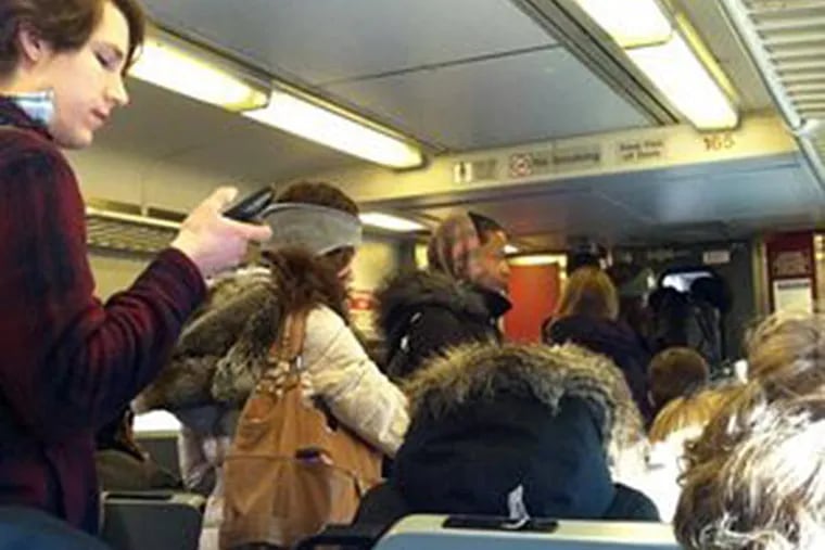 It was SRO on an inbound Doylestown train this morning. (Jennifer Lin/Staff)