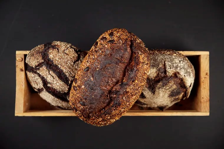 From left, buck honey rye, seedy grain, and homadama loaves are pictured at Lost Bread Co.'s baking facility in Craft Hall in Philadelphia's Northern Liberties section on Tuesday, Sept. 24, 2019.