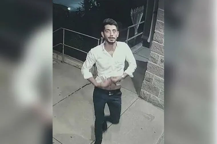 A man caught on surveillance video urinating on the front door of Congregation Beth Solomon in Northeast Philadelphia turned himself into police on Tuesday.