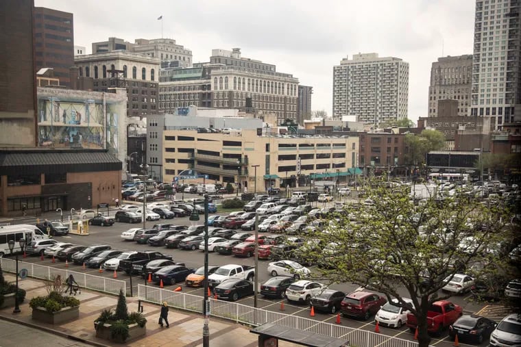 Cars and SUVs fill a parking lot at Eighth and Market Streets in Philadelphia. Nationwide, there are an estimated eight parking spaces for every vehicle.