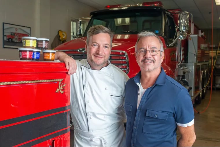 Volunteer firefighter Gino De Schrijver and his husband David Borgert at the firehouse in Erwinna, Pennsylvania.