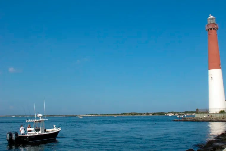 This Sept. 18, 2021 photo shows a boat near the Barnegat Inlet and Barnegat Lighthouse in Barnegat Light, N.J.