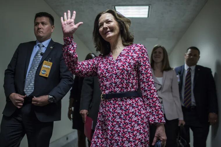 Gina Haspel, U.S. President Donald Trump's nominee for director of the Central Intelligence Agency, waves while walking to a meeting with Senators on Capitol Hill in Washington on May 7, 2018. (Zach Gibson / Bloomberg)