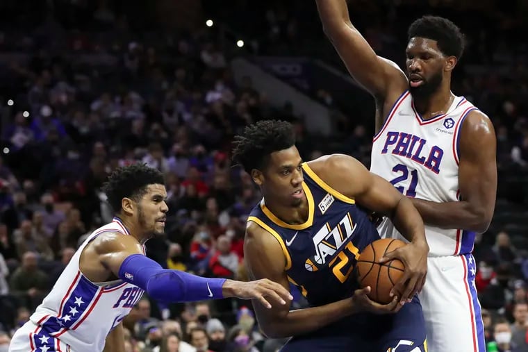 Sixers forward Tobias Harris and center Joel Embiid double team Utah Jazz center Hassan Whiteside during the first quarter.