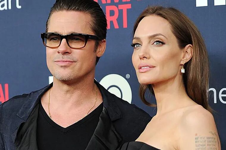 Brad Pitt and Angelina Jolie attend the premiere of HBO Films' "The Normal Heart" at the Ziegfeld Theatre on Monday, May 12, 2014, in New York. (Photo by Evan Agostini/Invision/AP)
