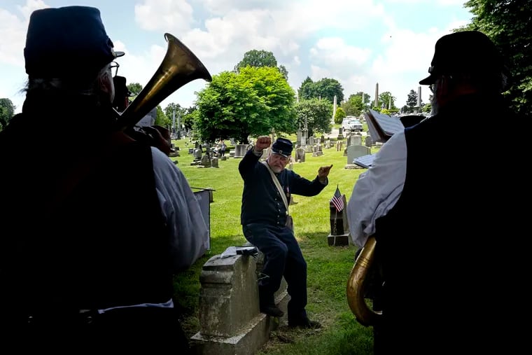 May 27, 2024: Jim Beyer, of Washington Township, N.J., conducts the Beck’s Philadelphia Brigade Band, which features original instruments and music from the Civil War era.