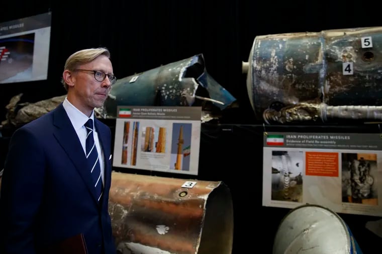 Brian Hook, U.S. special representative for Iran, walks past fragments of Iranian short range ballistic missiles (Qiam) at the Iranian Materiel Display (IMD) at Joint Base Anacostia-Bolling, in Washington, Thursday Nov. 29, 2018. The Trump administration accused Iran of stepping up violations of a U.N. ban on arms exports by sending rockets and other weaponry to rebels in Afghanistan and Yemen. The presentation displays weapons and fragments of weapons seized in Afghanistan, Bahrain and Yemen that it said are evidence Iran is a "grave and escalating threat" that must be stopped.  (AP Photo/Carolyn Kaster)