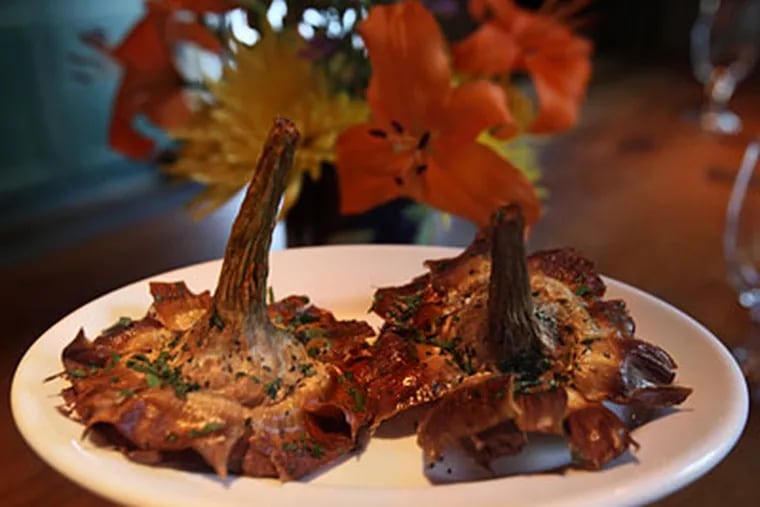 Fried long-stemmed artichokes, with an irresistible nutty savor. (DAVID M WARREN / Staff Photographer)