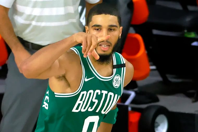 Jayson Tatum of the Boston Celtics celebrates a three-point shot during the second half.