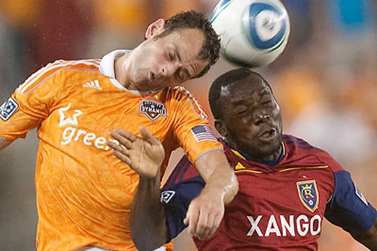 Houston's Brad Davis (left) is a top candidate to win MLS' Most Valuable Player award this season. (Patric Schneider/AP file photo)