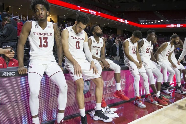 Temple sit dejected following their 55-53 loss to Cincinnati  at the Liacouras Center at Temple University on Jan 4, 2018.