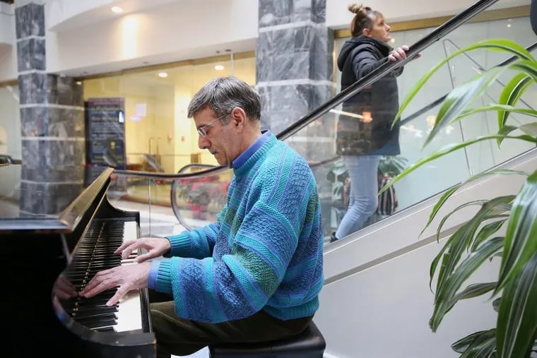Kurt Martin plays for passersby and regulars at the Lits Building.