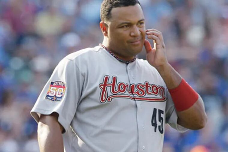 Houston Astros first baseman Carlos Lee pauses during the eighth
inning of a baseball game against the Chicago Cubs  in Chicago,
Saturday, June 30, 2012. The Cubs won 3-2. (AP Photo/Nam Y. Huh)