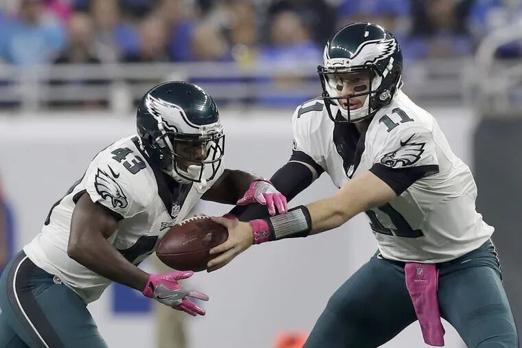 Darren Sproles takes a handoff from Carson Wentz during an October 2016 game in Detroit.