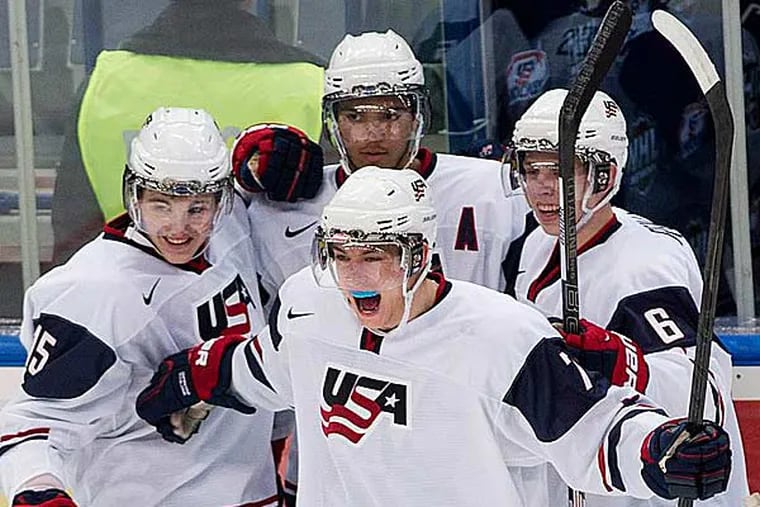 Team USA forward Sean Kuraly, center, celebrates his goal against Germany during the first period of an IIHF World Junior Championships hockey game in Ufa, Russia, Thursday, Dec. 27, 2012. (Nathan Denette/AP, The Canadian Press)