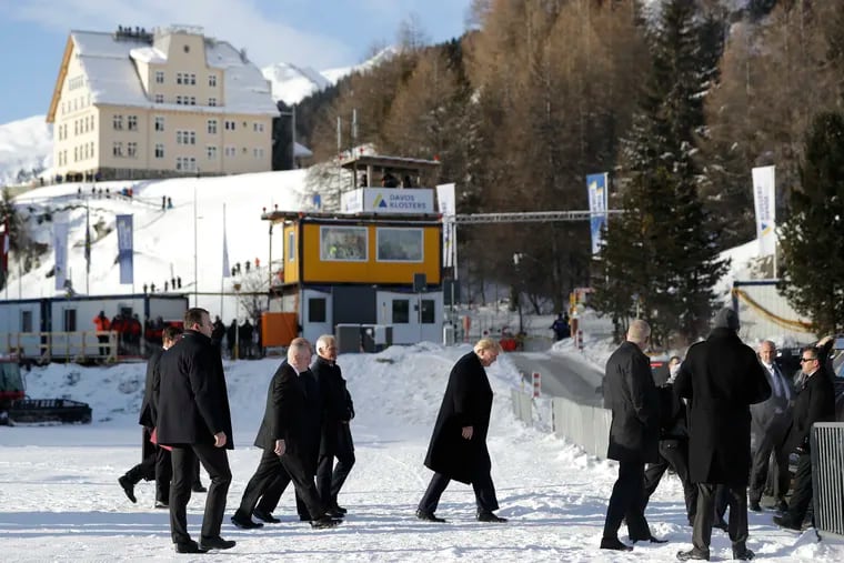 US President Donald Trump, center, arrives in Davos, Switzerland on Marine One, Tuesday, Jan. 21, 2020. President Trump arrived in Switzerland on Tuesday to start a two-day visit to the World Economic Forum.
