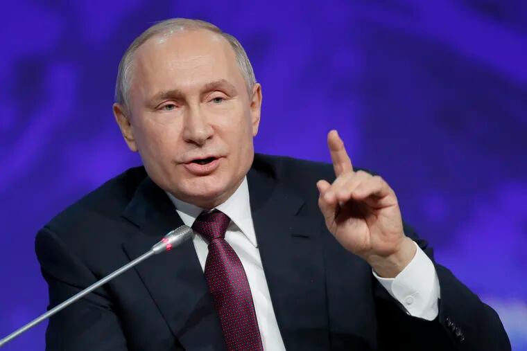 Russian President Vladimir Putin gestures while speaking at a plenary session of the International Arctic Forum in St. Petersburg, Russia, Tuesday, April 9, 2019. (AP Photo/Dmitri Lovetsky)