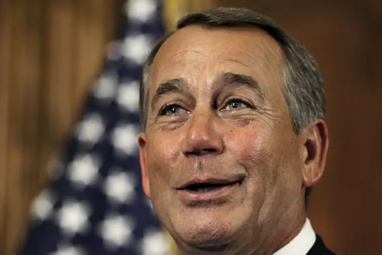 House Speaker John Boehner smiles as he participates in a ceremonial House swearing-in ceremony with representatives. (Charles Dharapak / AP Photo)