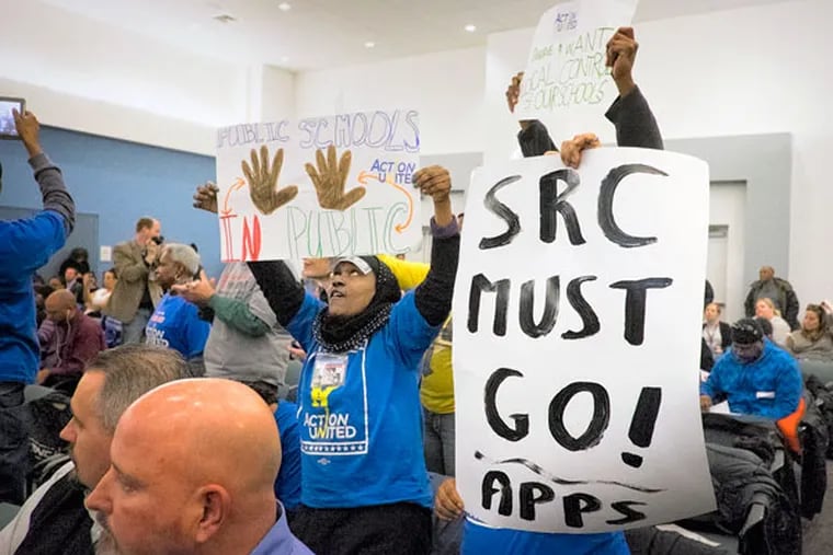 Protesters disrupt opening proceedings at the School Reform Commission hearing on charter schools. (ED HILLE / STAFF PHOTOGRAPHER)