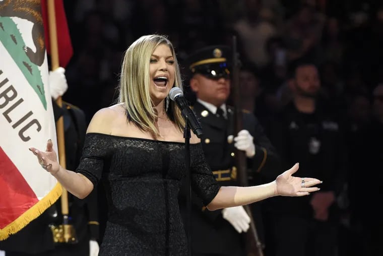 Singer Fergie performs the national anthem prior to an NBA All-Star basketball game, Sunday, Feb. 18, 2018, in Los Angeles.