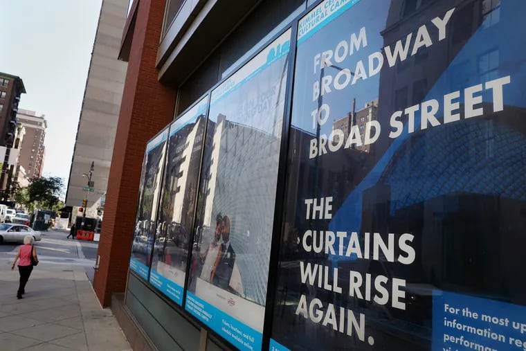 Outside of the Kimmel Center at Broad and Spruce Streets, a sign reassures patrons that performances will one day return.