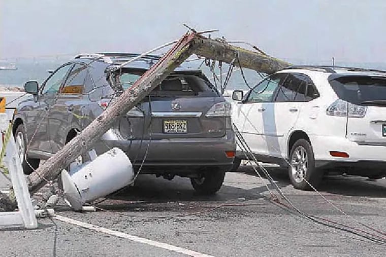 File: An electric pole downed in Margate by derecho.