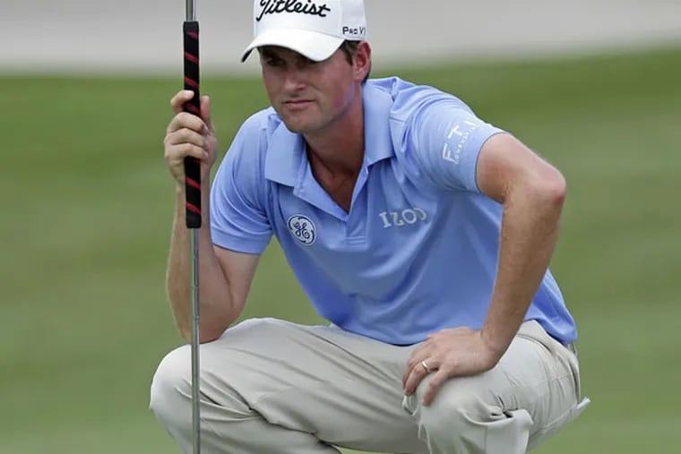 Webb Simpson looks over his putt on the second green during the third round of The Players championship golf tournament at TPC Sawgrass, Saturday, May 11, 2013, in Ponte Vedra Beach, Fla. (Chris O'Meara/AP)