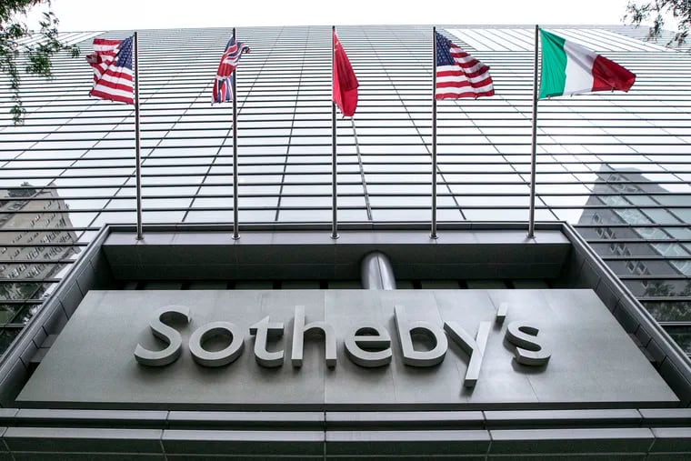 Flags fly on the front of Sotheby's auction house, in New York, Monday, June 17, 2019. BidFair USA is taking auction house Sotheby's private in a deal valued at $3.7 billion. (AP Photo/Richard Drew)