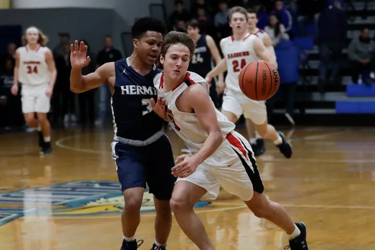 Haddonfield High's Mike Depersia (right) gets fouled going after the basketball by St. Augustine Prep's Jordyn Kendrick during the first-quarter in the Paul VI 2019 Winter Classic Boys High School Basketball Showcase on Saturday, February 9, 2019.