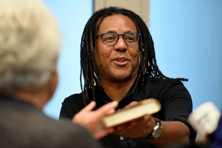 Colson Whitehead, author of &quot;The Underground Railroad,&quot; autographs copies of his book during a &quot;One Book One Lower Merion&quot; event in Ardmore December 4, 2016.