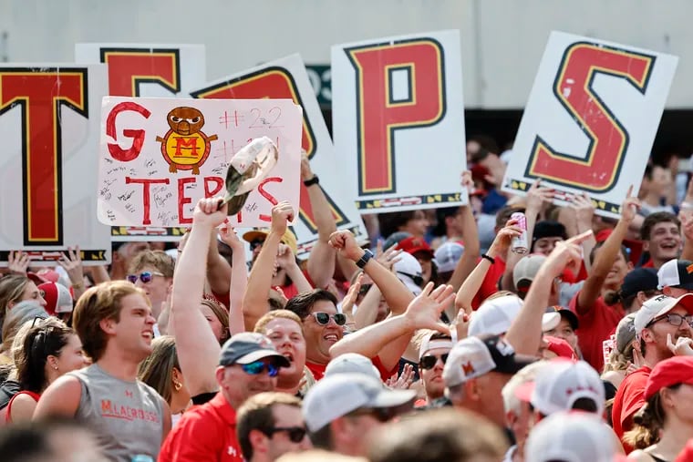 Maryland fans celebrate a first-quarter goal against Virginia in the NCAA men's lacrosse championships semifinal round game on Saturday at Lincoln Financial Field.