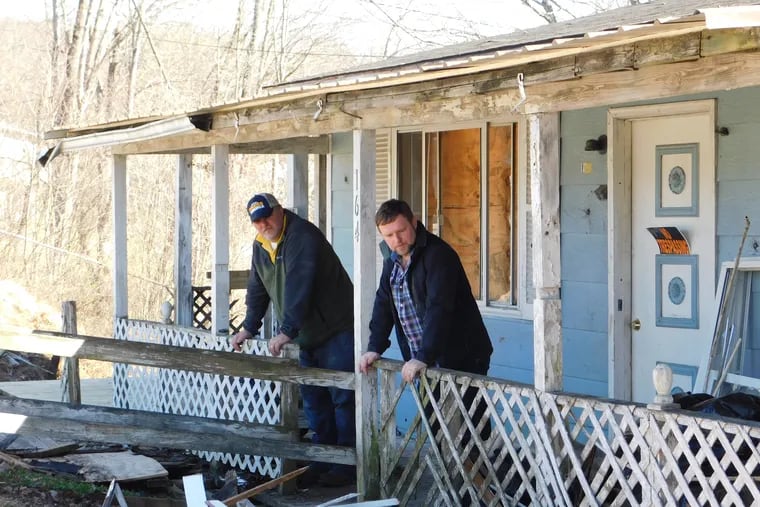 Brothers Jasen (left) and Mark Edwards on the porch of their childhood home in Sophia, West Va. Both have struggled with opioid addiction and tell their stories in "Addiction," a "Nova" film airing on PBS on Wednesday, Oct. 17