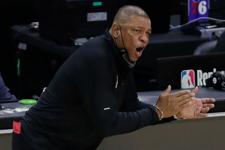 Sixers coach Doc Rivers cheers on his team during the fourth quarter of the team's Game 1 victory over the Wizards.