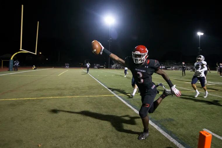 Saint McLeod of Imhotep celebrates as he scores a touchdown against Malvern Prep during the 2nd half on Sept. 13, 2019 at Johnston Memorial Stadium in Philadelphia.   Imhotep won 28-14.