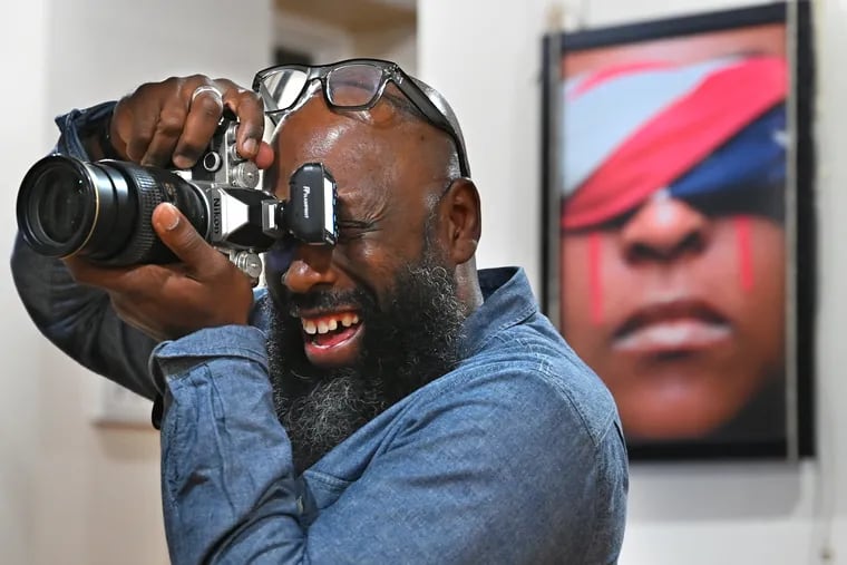 Montgomery's fine art focuses on inspirational, cultural, and societal themes. The photograph on the wall is from his series, "I, Too, Cry for America." His work has been displayed over the past 25 years, but Montgomery says, “A lot of people I serve will never go to a museum, but they will definitely walk down their street several times a day.”