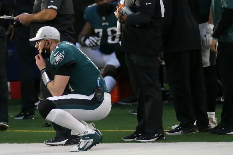 Carson Wentz watched the Eagles' 37-17 loss to the Cowboys from the sidelines.
