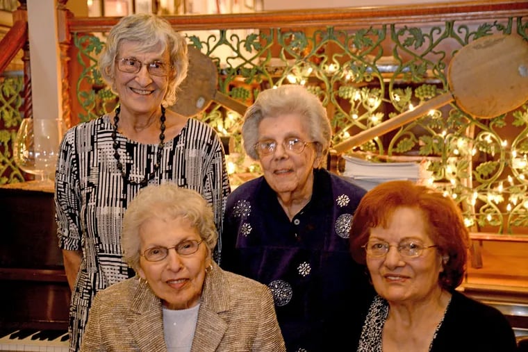 Friends for eight decades: Regina Braccili, and Regina Luchi (standing, from left), with Rita LaRocca (left) and Anna Marie Campagna at this year’s gathering at Francoluigi’s in South Philly.