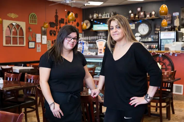 Yalli Avitan (right), co-owner of Judah Mediterranean Grille, and her sister Ariel say the thief waited until the staff was busy serving customers before swiping the tip jar.